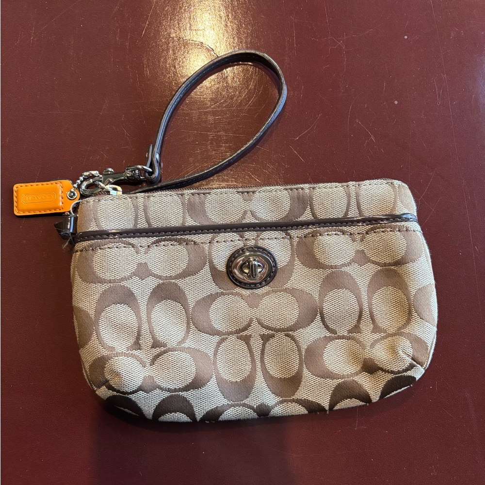 Elegant Brown Coach Park Wristlet with Signature Design